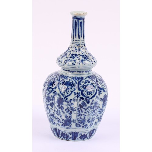 786 - An 18th century Delft lobed bottle vase, of double gourd form, decorated in underglaze blue in the C... 