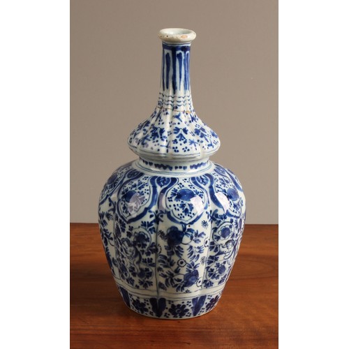 786 - An 18th century Delft lobed bottle vase, of double gourd form, decorated in underglaze blue in the C... 