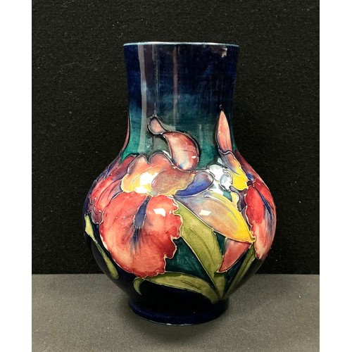 5023 - A Moorcroft Iris pattern ovoid vase, tube lined with flowerheads and leaves in shades of pink, lilac... 