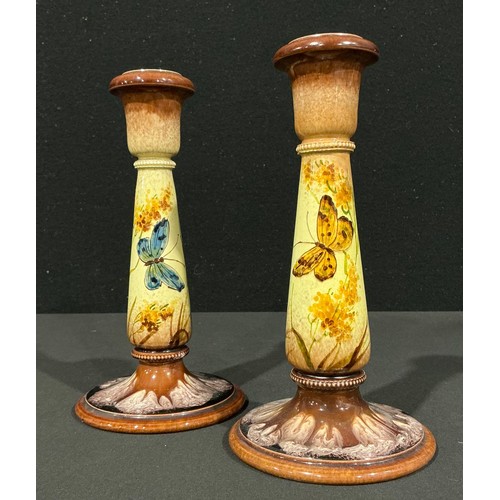 5032 - A pair of Ault Pottery candlesticks, designed by Christopher Dresser (1834 - 1904), decorated by Cla... 