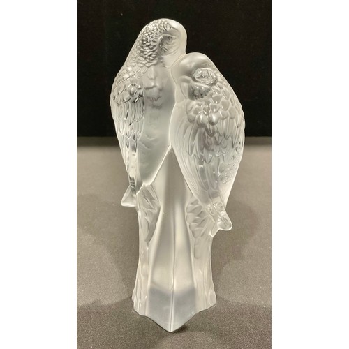 5041 - A Lalique frosted glass model, of two parakeets, the two birds perched on a stylised stump, engraved... 