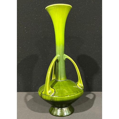 5061 - A Bretby Pottery pedestal vase, after a design by Christopher Dresser (1834 - 1904), of sinuous natu... 