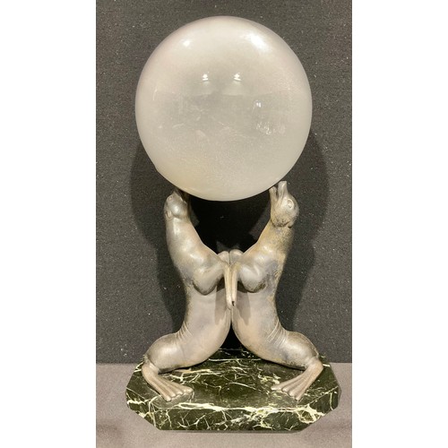 5062 - Louis-Albert Carvin (1875-1951) Art Deco table lamp, two cast spelter seals balancing a frosted glas... 