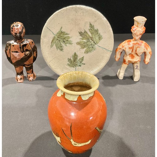 5067 - Studio Pottery - a geometric sculptural figure, in mottled tones of brown, 18cm high; another simila... 