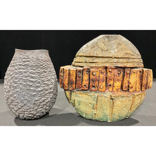 5069 - Studio Pottery - a stoneware flattened ovoid vase, by Bernard Rooke, modelled with a central band of... 