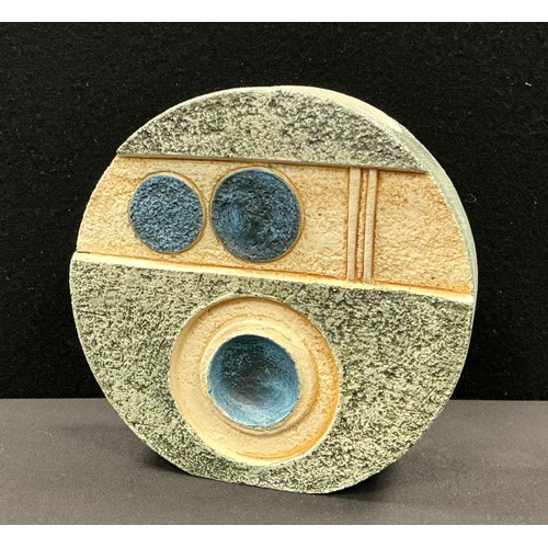 5089 - A Troika wheel vase, by Sue Lowe, decorated with roundels and geometric shapes in shades of green, b... 