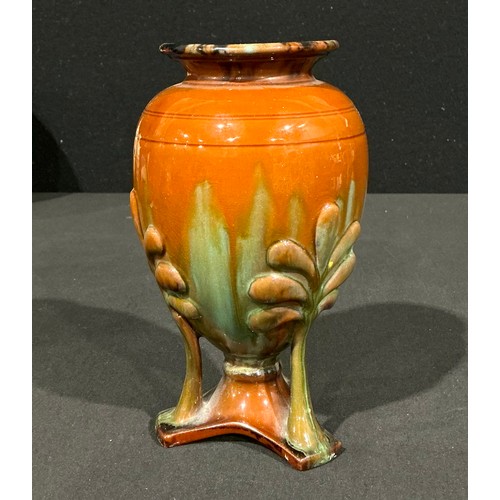 5107 - An Arts & Craft period terracotta urnular pedestal vase, in the manner of Christopher Dresser, drip ... 