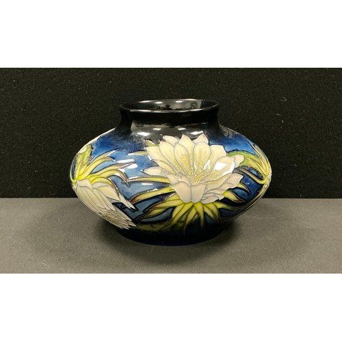 5111 - A Moorcroft compressed ovoid vase, Queen of the Night pattern, designed by Anji Davenport, tube line... 