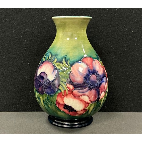 5114 - A Moorcroft Anemone pattern baluster vase, decorated with large flowers and foliage, on a green grou... 