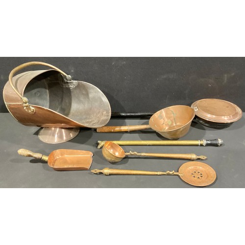 5259 - A Victorian copper coal scuttle, brass handles, 48cm long; a copper pan, 50.5cm long; a copper warmi... 