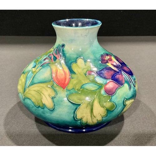 5081 - A Moorcroft Columbine pattern compressed ovoid vase, tube lined with leafy flowerheads in shades of ... 