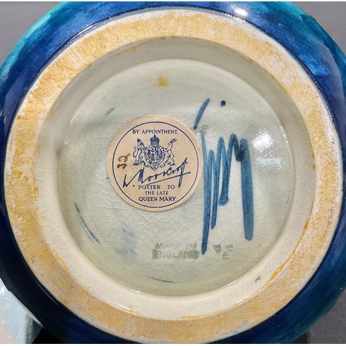 5081 - A Moorcroft Columbine pattern compressed ovoid vase, tube lined with leafy flowerheads in shades of ... 