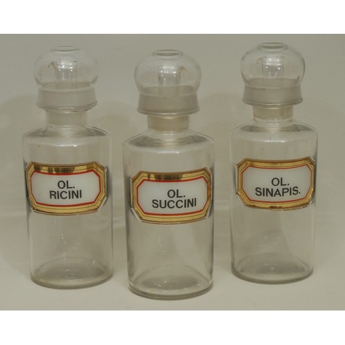 5588 - A 19th century clear glass apothecary oil jar and cover, gilt border label, Ol. Ricini, 26cm high ov... 