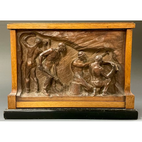 57 - Manner of Constantin Meunier (Belgian 1831 - 1905), a carved boxwood bas relief, Miners at Work, wal... 