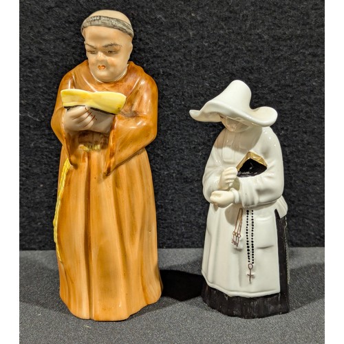 5661 - A Royal Worcester figural candle snuffer as a monk, 12cm, printed mark in puce; another as a nun, 9.... 