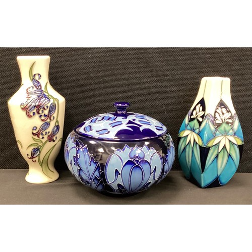 5 - Moorcroft pottery - a group of three decorative pieces including, an Ashgrove pattern lidded ovoid j... 