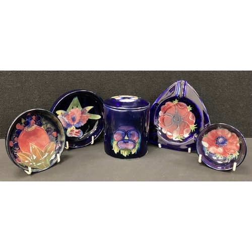7 - Moorcroft pottery - a group of five decorative pieces including, a Pomegranate pattern circular pin ... 