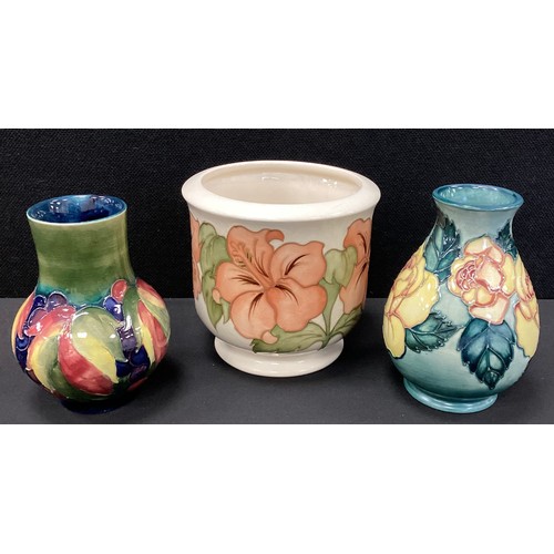 9 - Moorcroft pottery - a group of three decorative pieces including, a limited edition rose pattern vas... 