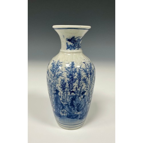 15 - A Chinese porcelain vase, decorated with scholars in a woodland setting in tones of underglaze blue ... 
