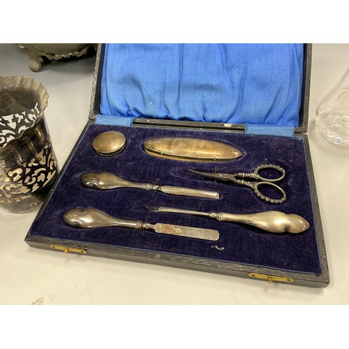 25 - Silver and metal ware - a silver handled manicure set, Birmingham, cased;  silver-plated teapot, pew... 