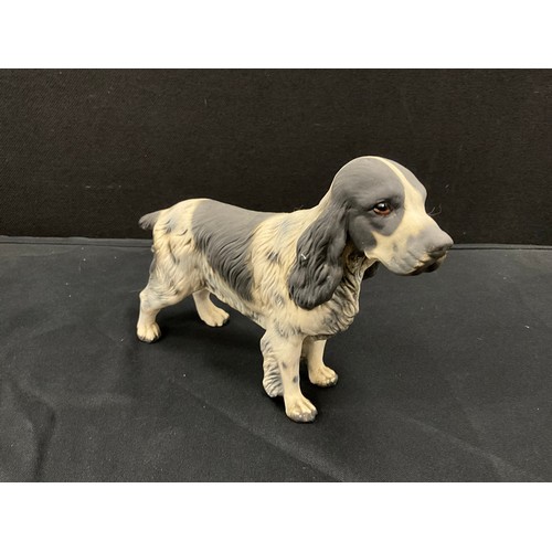 38 - Model dogs including, a Goebel porcelain model of a Pointer, 27cm long, Royal Doulton shooting dog w... 