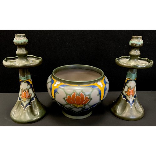 42 - A pair of Gouda Hollandia candlesticks, painted with flowers, shape number 099, painted and impresse... 