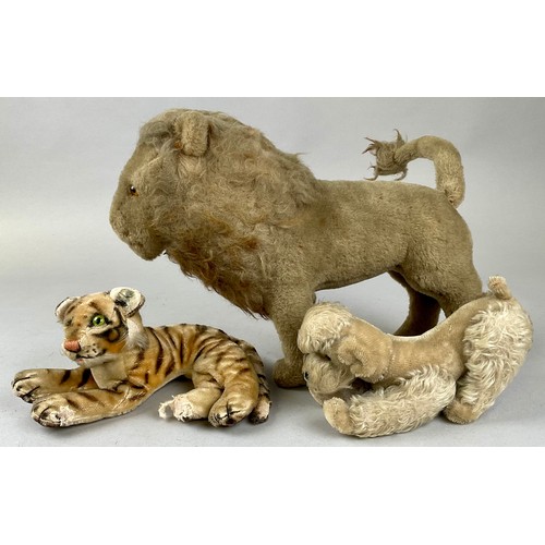 6056 - A mid-century Steiff mohair poodle, articulated legs, 23cm high overall, white metal badge to ear; a... 