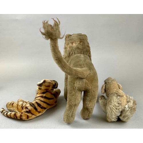 6056 - A mid-century Steiff mohair poodle, articulated legs, 23cm high overall, white metal badge to ear; a... 