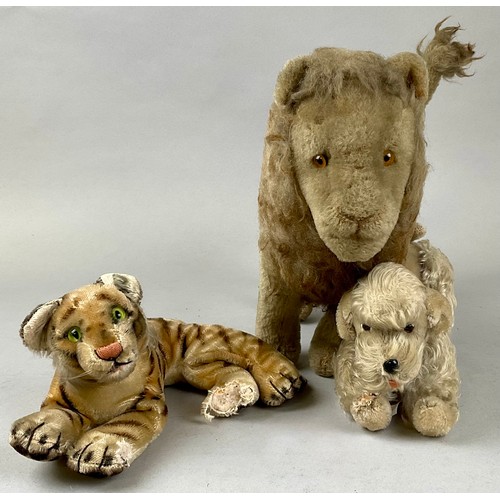 6056 - A mid-century Steiff mohair poodle, articulated legs, 23cm high overall, white metal badge to ear; a... 