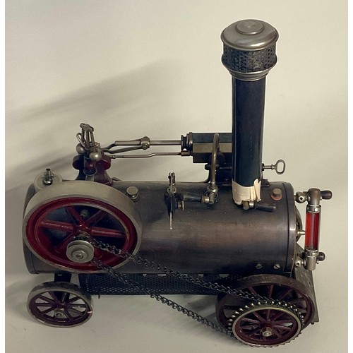 6018 - An early 20th century Bing live steam traction engine, chain drive to rear wheel, single fixed cylin... 