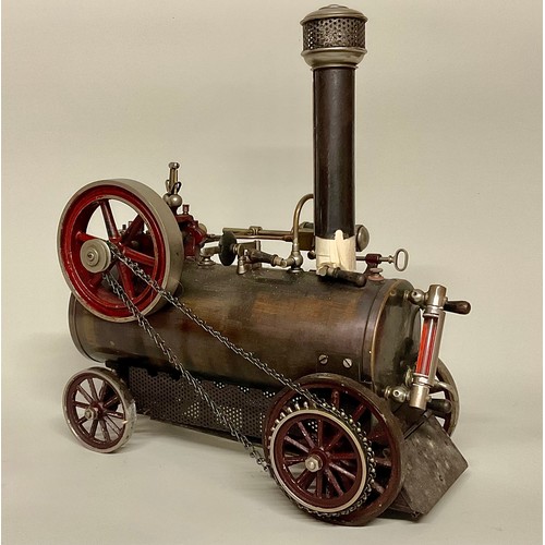 6018 - An early 20th century Bing live steam traction engine, chain drive to rear wheel, single fixed cylin... 