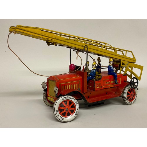 6001 - An early 20th century Distler (Germany) tinplate clockwork fire engine with electric light, four sea... 