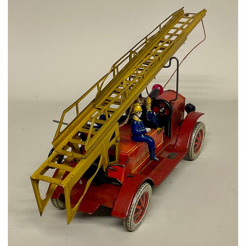6001 - An early 20th century Distler (Germany) tinplate clockwork fire engine with electric light, four sea... 