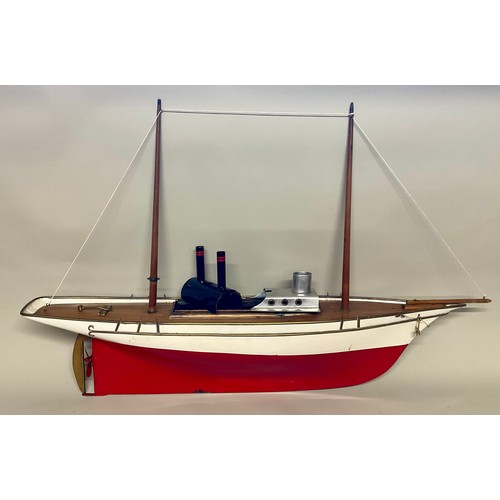 6011 - A live steam pond yacht / hobby yacht, red hull with wooden decking and rigging, with boiler to inte... 