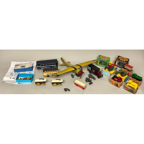6047 - A Wells-Brimtoy yellow tinplate clockwork monoplane, K3520, 42.5cm wingspan; another, a Triang Minic... 