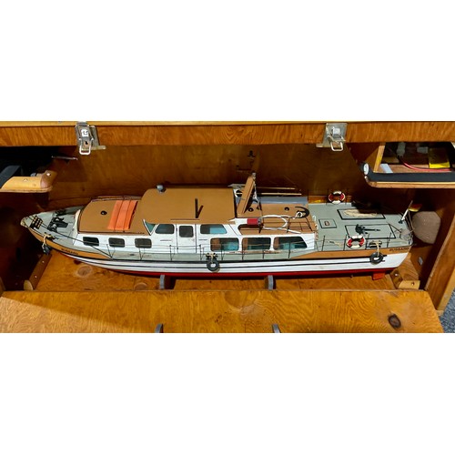 6045 - A hand made model radio controlled boat, in a carry/display case, Futaba, the wooden outer hinged ca... 