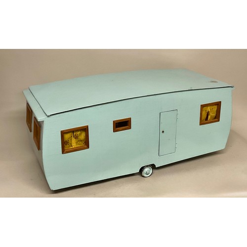 6046 - A scratch built child's model caravan, fitted with accessories and dolls, 34cm high, 80cm wide