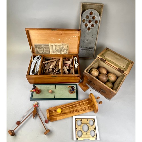 6044 - Toys & Juvenalia - a 19th century French set of boules, the stained pine box naively painted with na... 
