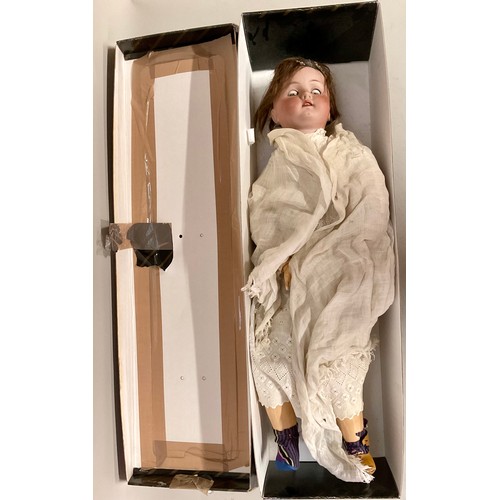 6041 - Dolls - A large early 20th century bisque headed doll with painted features and sleeping glass eyes,... 