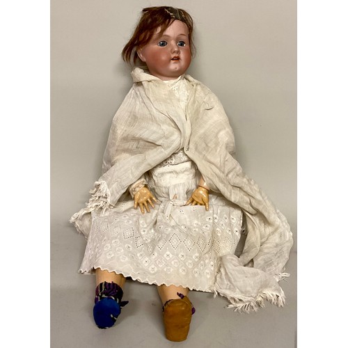6041 - Dolls - A large early 20th century bisque headed doll with painted features and sleeping glass eyes,... 