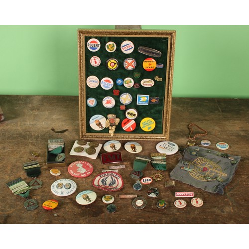 8004 - A collection of mostly motoring related pin badges and tie pins, including Jaguar, BP, ESSO, Shell, ... 