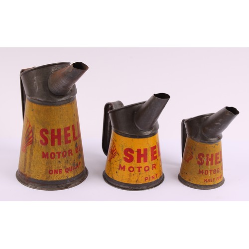 Petroliana - a mid 20th century graduated set of three tin oil pourers ...