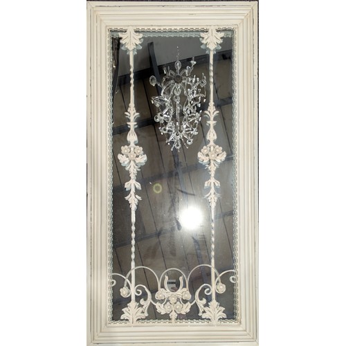 5522 - A large contemporary white painted metal looking glass, the rectangular mirror plate set behind wrou... 