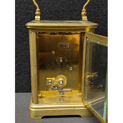 5038 - A French lacquered brass carriage timepiece, the 5.5cm rectangular enamel clock dial inscribed with ... 
