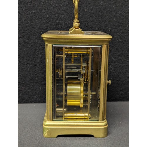 5038 - A French lacquered brass carriage timepiece, the 5.5cm rectangular enamel clock dial inscribed with ... 