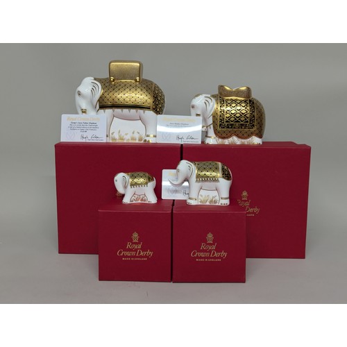 3259 - A Royal Crown Derby paperweight family group, comprising Gump's Aura Father Elephant, exclusive to G... 