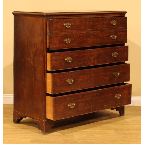 4 - A George III oak secretaire chest, of four long drawers, the upper disguised as two, with fall front... 