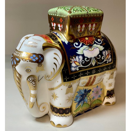 3016 - A Royal Crown Derby paperweight, Father Elephant, with howdah, gold stopper, 15.5cm high, 17cm long,... 