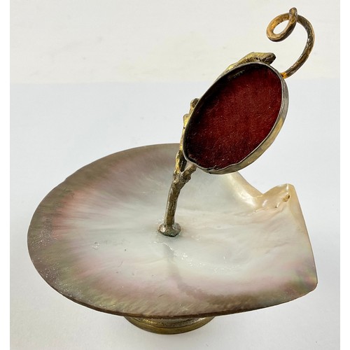 3018 - A French gilt metal and mother-of-pearl pocket watch stand, naturalistic support, 12cm high overall