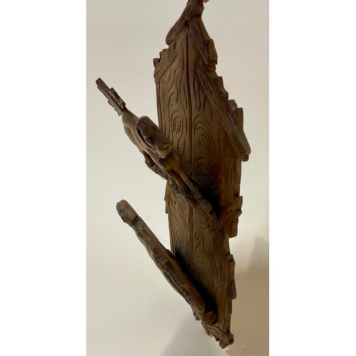 3003 - A Black Forest novelty wall hanging letter rack, carved with two St Bernard dogs, 30cm long, c.1900